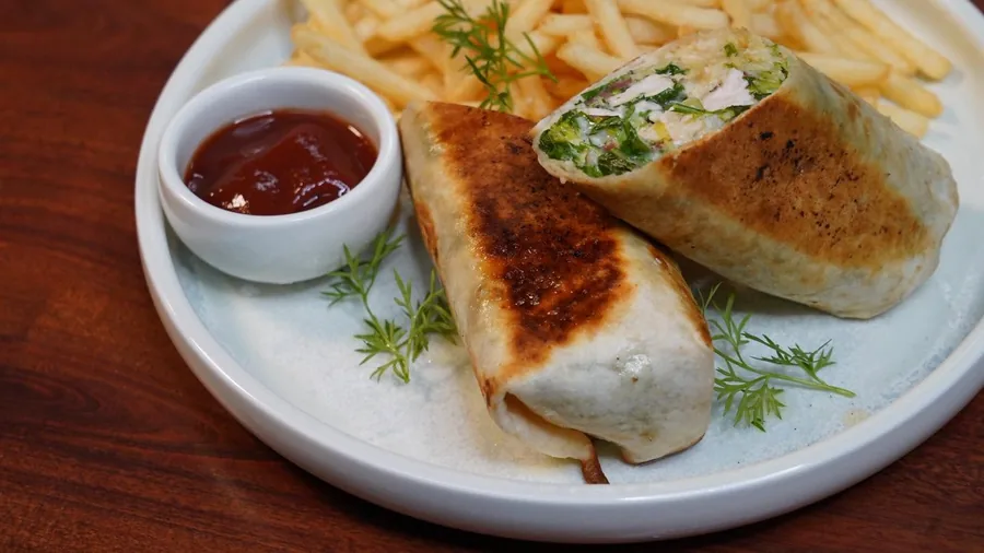 Toasted wrap served with fries and tomato sauce at Cafe Cosy Moss Vale